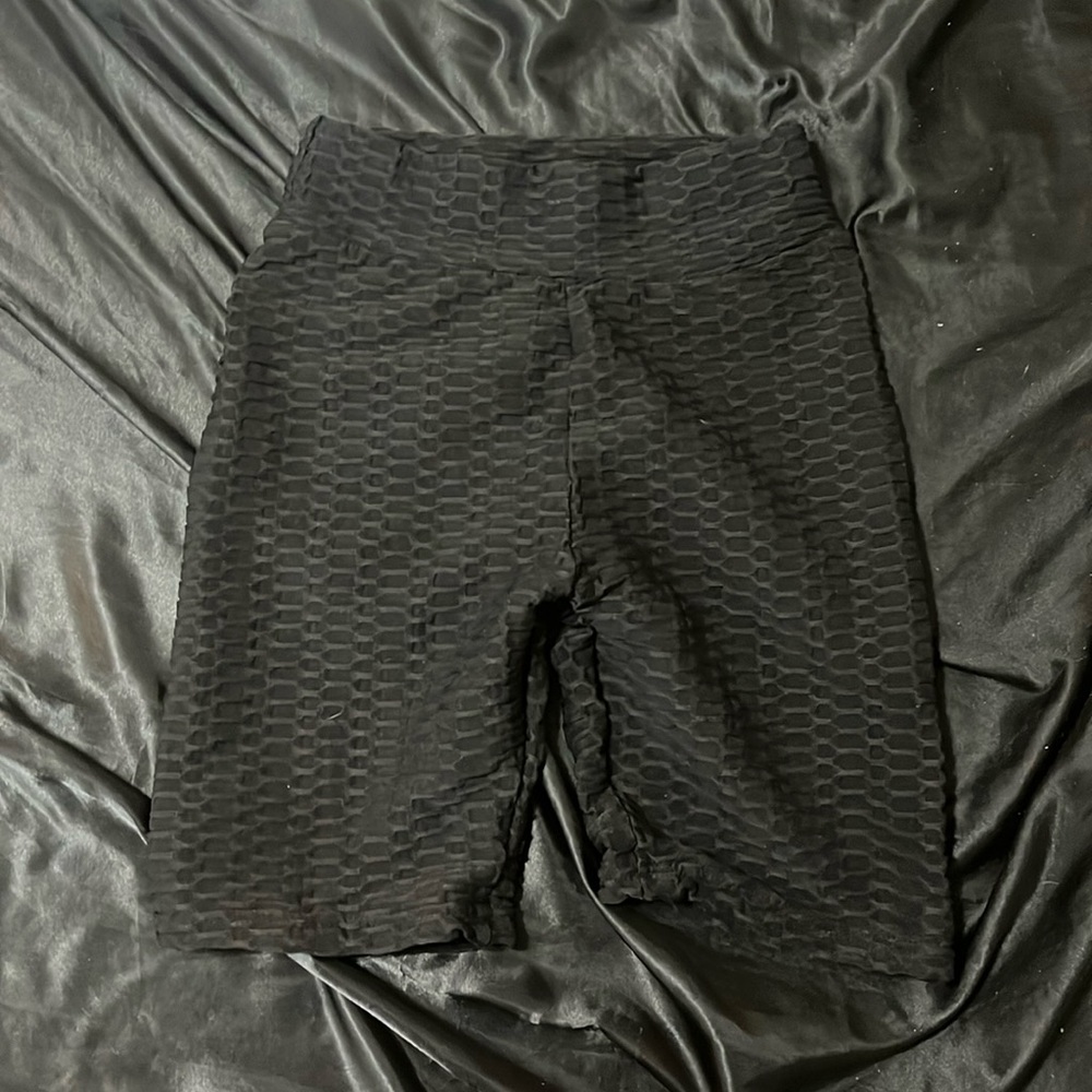 Black rubbed working out shorts.